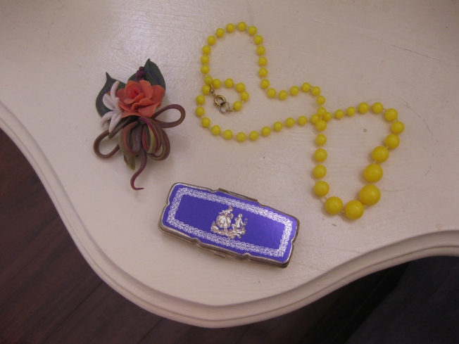 My Nanna’s brooch and little pillbox and my Mum’s beads that go perfectly with my favourite yellow dress.